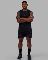 Man wearing Base FLXCotton Tank - Black | Model:Sam | Size:L