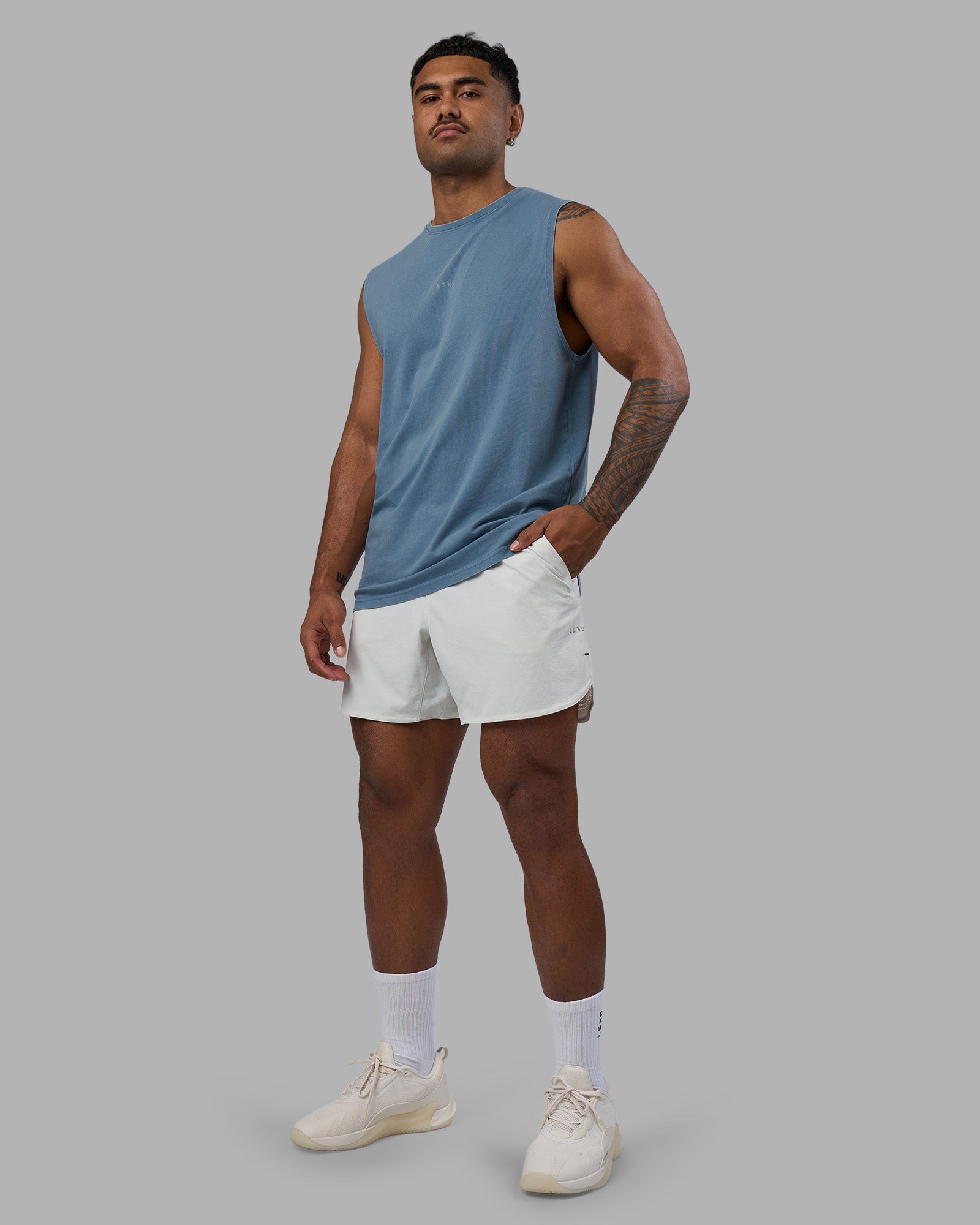 Man wearing Base FLXCotton Tank - Elemental Blue Washed | Model:Xav | Size:L