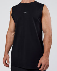Man wearing Base FLXCotton Tank Regular Fit +2cm - Black | Model:Adam | Size:L