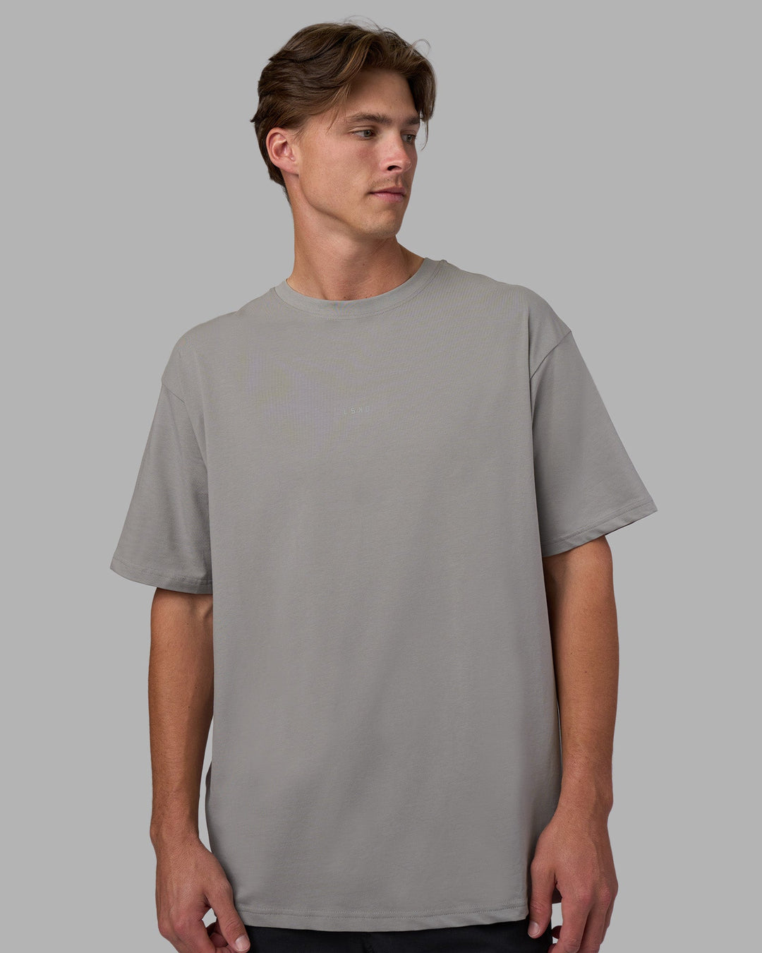 Man wearing Base FLXCotton Tee Oversized - Circular-Grey  Model:Brandon | Size:L - view 1