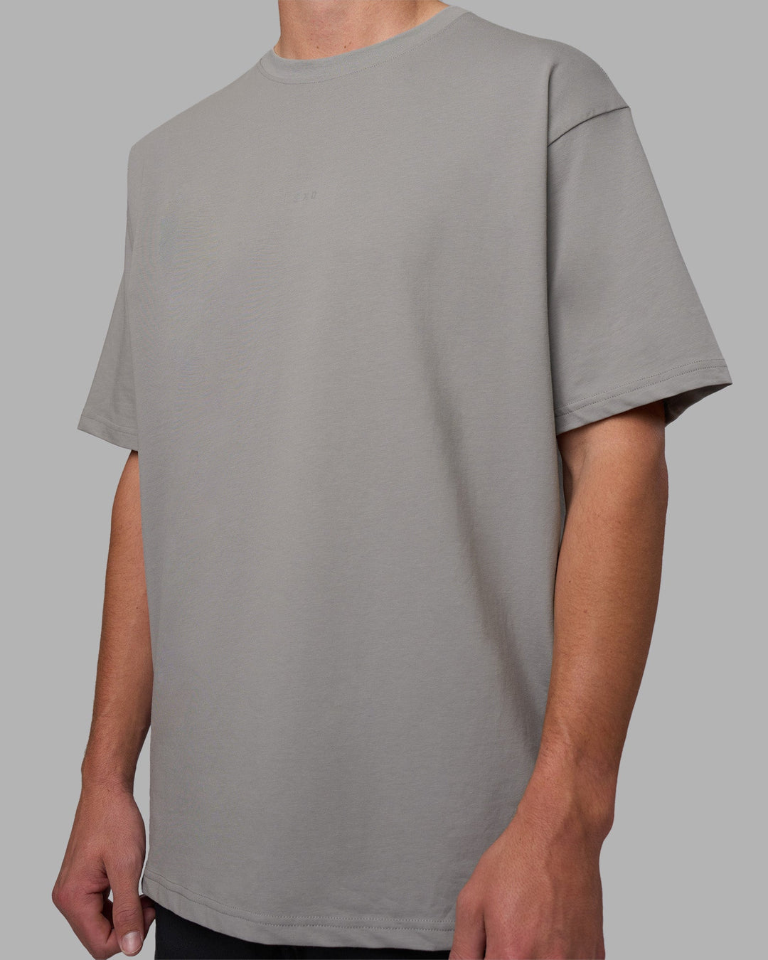 Man wearing Base FLXCotton Tee Oversized - Circular-Grey  Model:Brandon | Size:L - view 2
