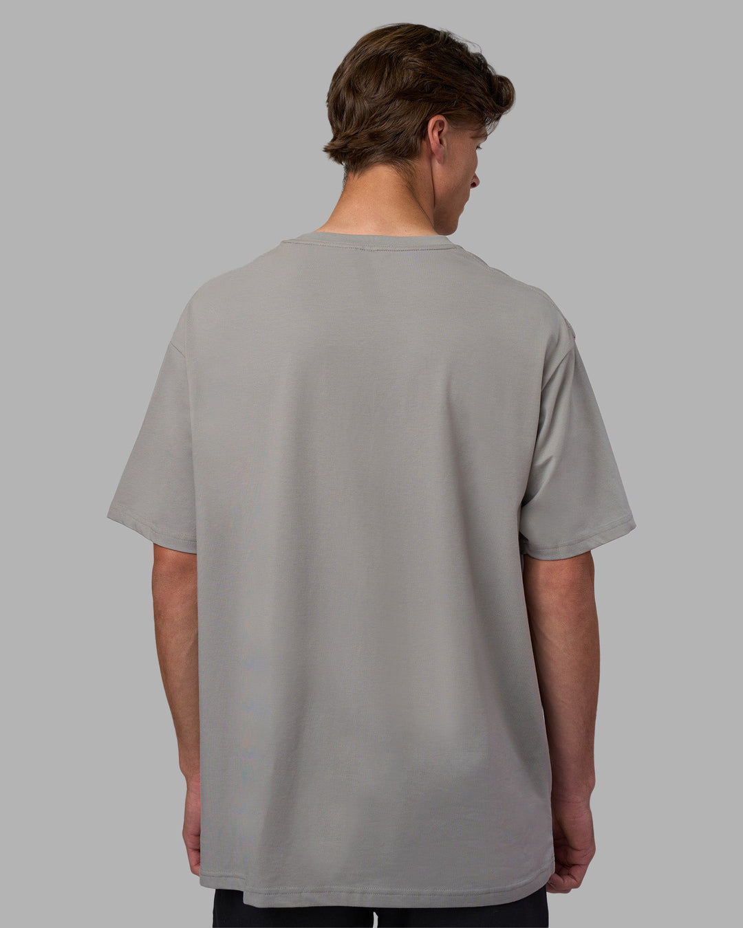 Man wearing Base FLXCotton Tee Oversized - Circular-Grey  Model:Brandon | Size:L - view 3