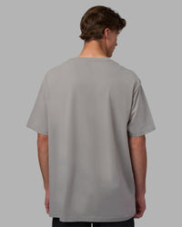 Man wearing Base FLXCotton Tee Oversized - Circular-Grey  Model:Brandon | Size:L | Thumbnail Index: 2