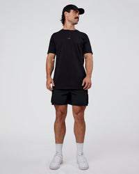 Man wearing Base FLXCotton Tee  Regular Fit +2cm - Black | Model:Adam | Size:L