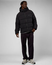 Man wearing Base Puffer Jacket - Black | Model:Okello | Size:L