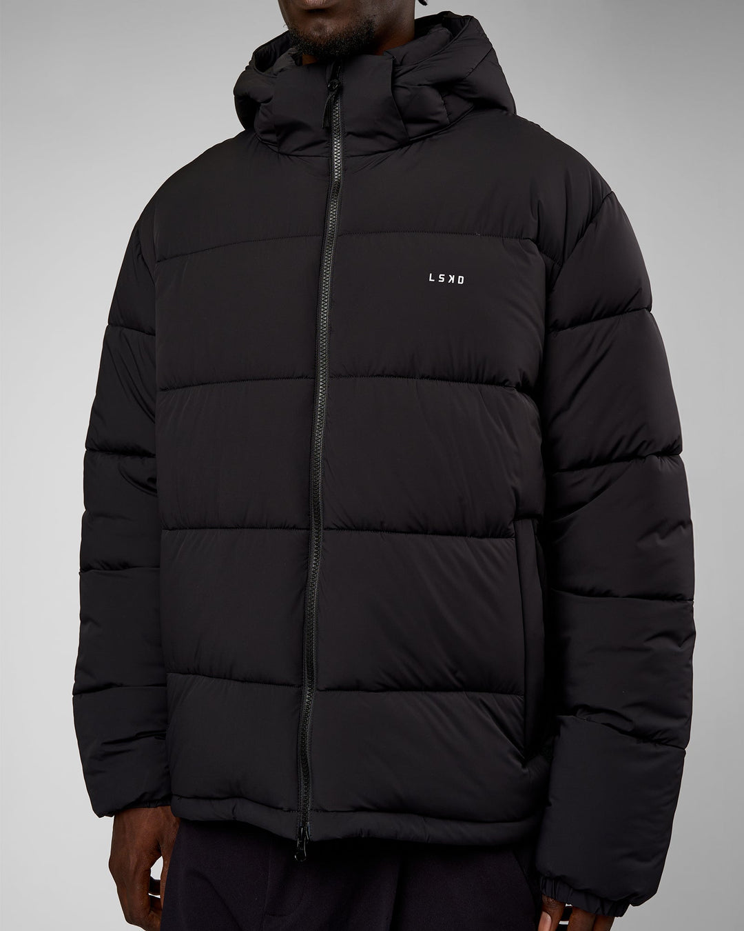 Man wearing Base Puffer Jacket - Black | Model:Okello | Size:L