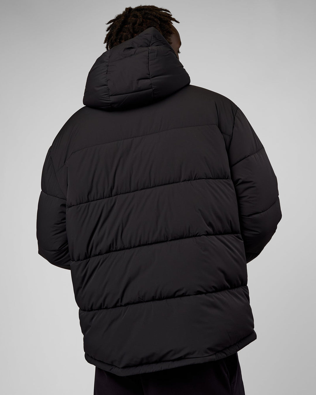 Man wearing Base Puffer Jacket - Black | Model:Okello | Size:L