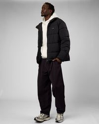 Man wearing Base Puffer Jacket - Black | Model:Okello | Size:L