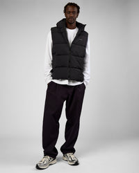 Man wearing Base Puffer Vest - Black | Model:Okello | Size:L