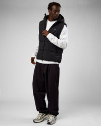 Man wearing Base Puffer Vest - Black | Model:Okello | Size:L