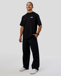 Man wearing Break Through FLXCotton Oversized Tee - Black-Open Air | Model:Jaiden | Size:L
