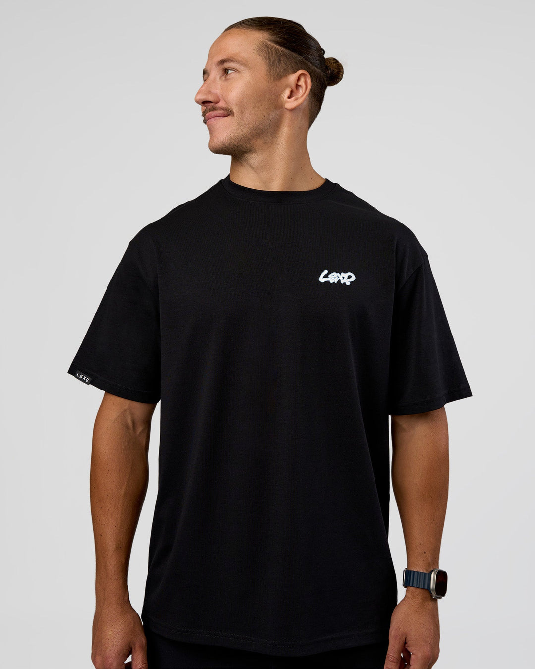 Man wearing Break Through FLXCotton Oversized Tee - Black-Open Air | Model:Jaiden | Size:L