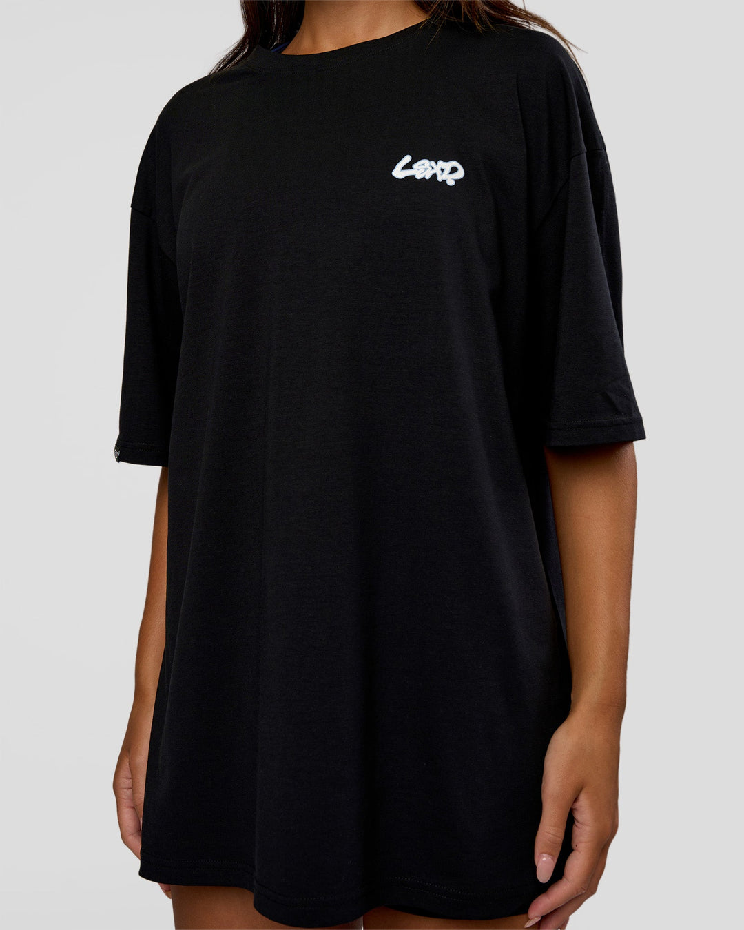 Woman wearing Break Through FLXCotton Oversized Tee - Black-Open Air | Model:Kirstyn | Size:L