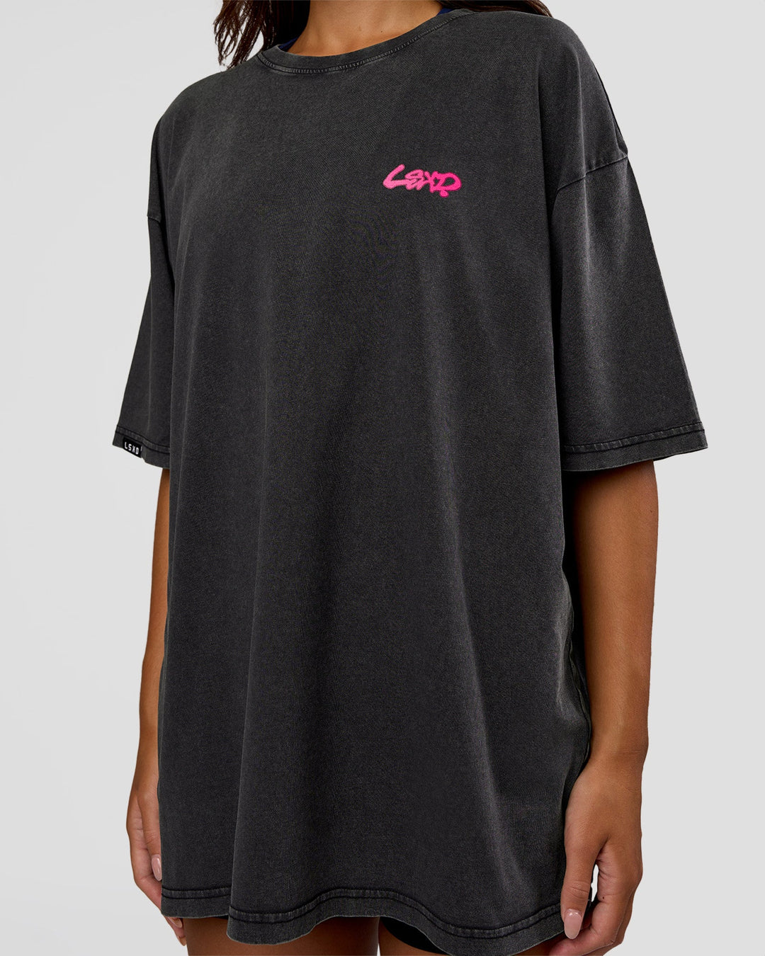 Woman wearing Break Through FLXCotton Oversized Tee - Black-Plum Caspia | Model:Kirstyn | Size:L