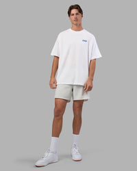 Man wearing Break Through Heavyweight Oversized Tee - White-Power Cobalt | Model:Brandon | Size:L