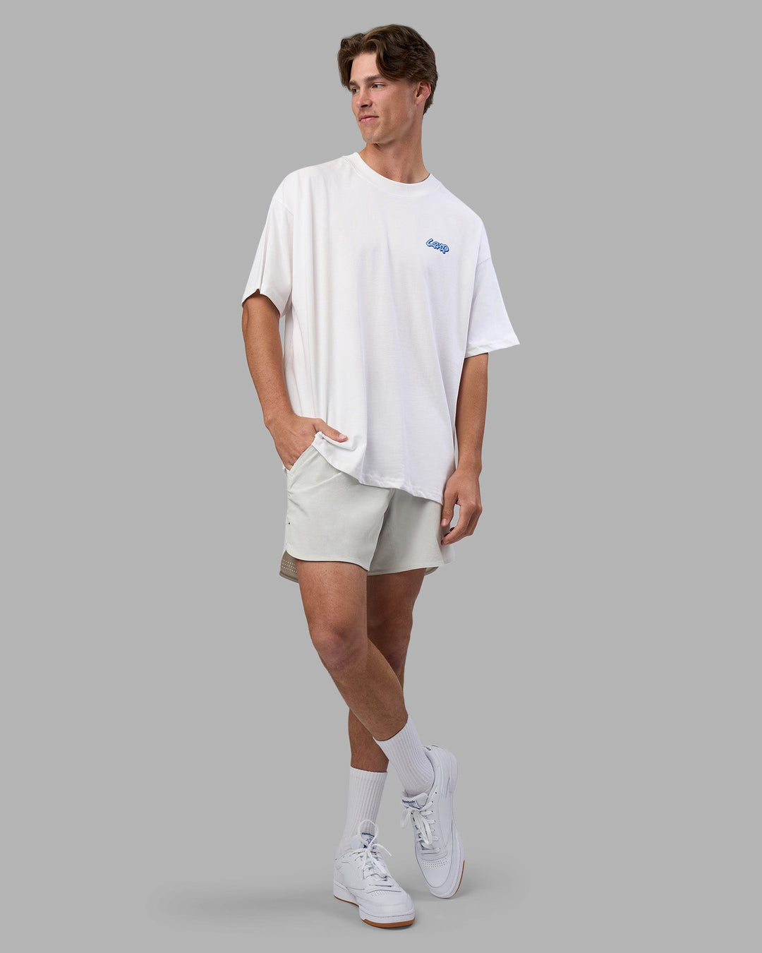 Man wearing Break Through Heavyweight Oversized Tee - White-Power Cobalt | Model:Brandon | Size:L