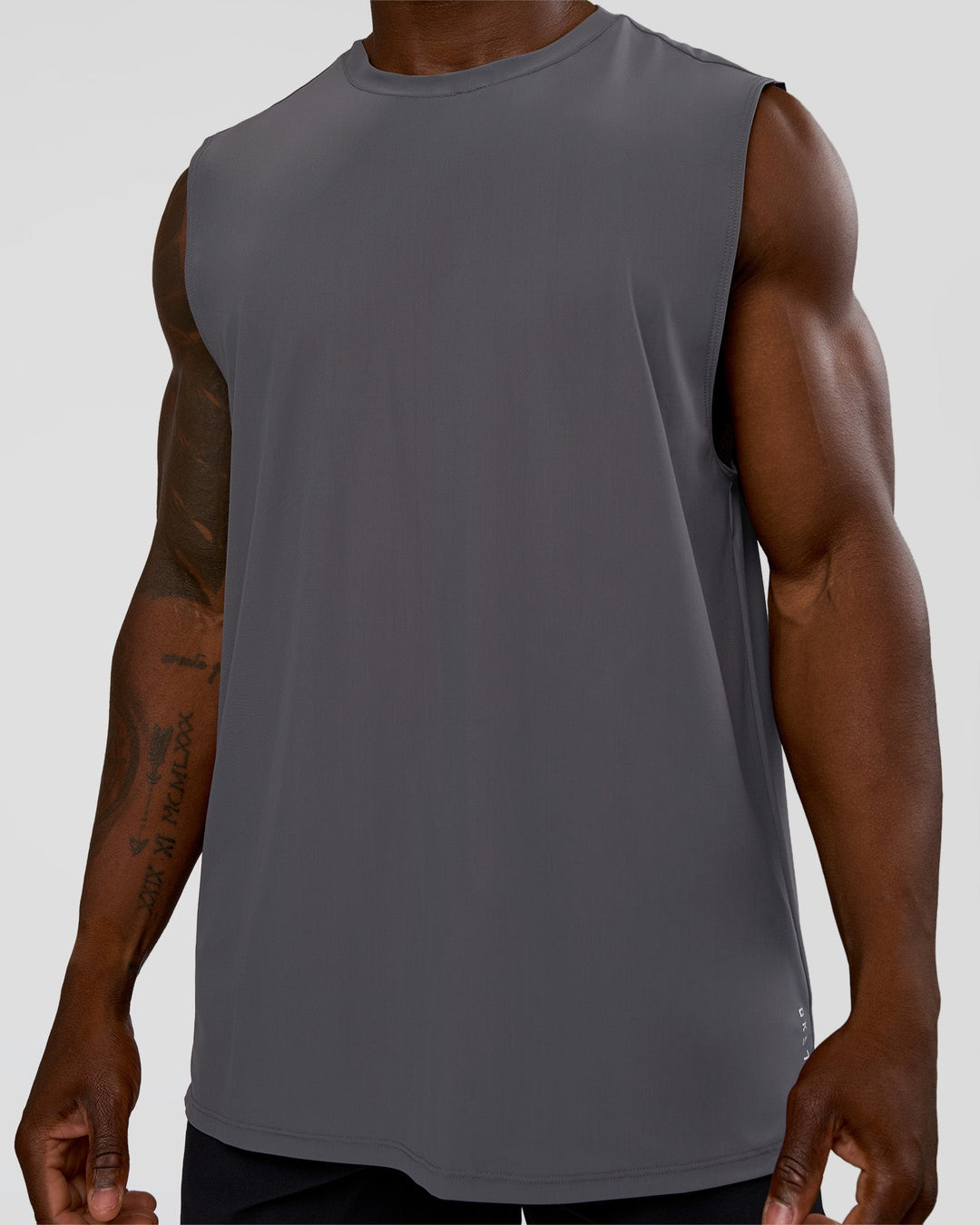 Man wearing Cadence MicroMotion Muscle Tank - Dark Storm | Model:Sam | Size:L