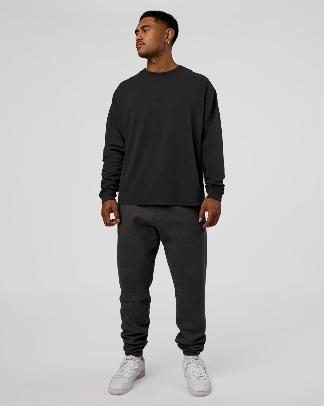 Man wearing Classic Heavyweight FLXCotton Oversized Long Sleeve Tee - Washed Black-Black | Model:Xav | Size:L