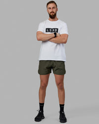 Man wearing Competition 5" Performance Short - Forest Night