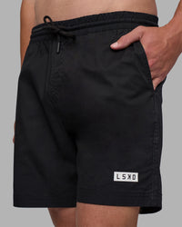 Man wearing Daily 7" Short - Black-White | Model:Brandon | Size:L