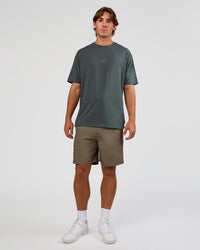 Man wearing Daily 7" Short - Walnut Grey | Model:Marcus | Size:L