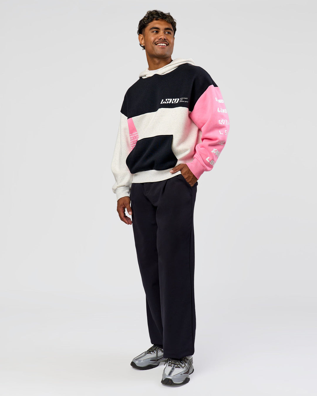 Man wearing Deconstructed Fleece Hoodie - Caviar-Candy Pink-Grey Marl | Model:Xav | Size:L
