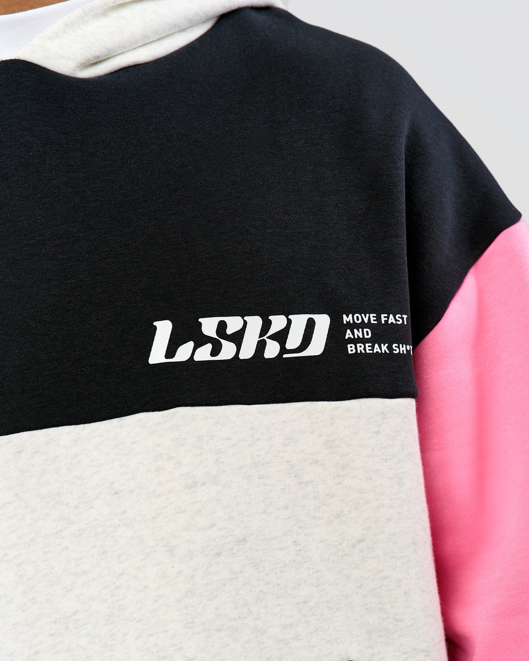 Man wearing Deconstructed Fleece Hoodie - Caviar-Candy Pink-Grey Marl | Model:Xav | Size:L