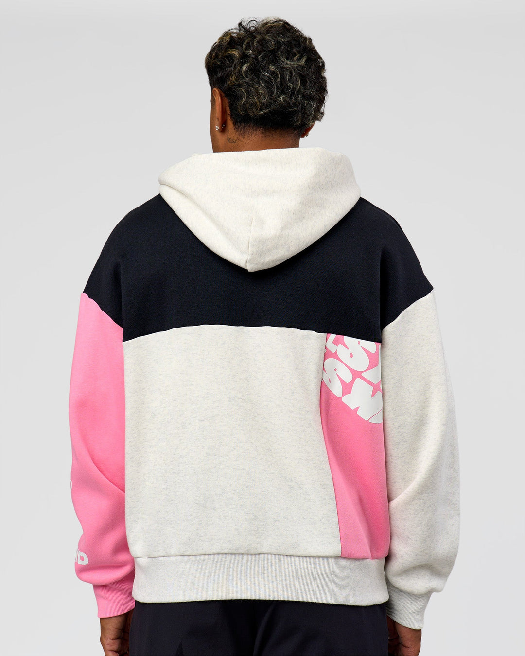 Man wearing Deconstructed Fleece Hoodie - Caviar-Candy Pink-Grey Marl | Model:Xav | Size:L