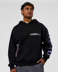 Man wearing Deconstructed Fleece Hoodie - Caviar-Marshmallow-Pale Lilac | Model:Xav | Size:L