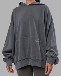 Woman wearing ETJ Values Washed Unisex Oversize Hoodie - Dark Storm-Light Bubblegum | Model:Rhiley | Size:L