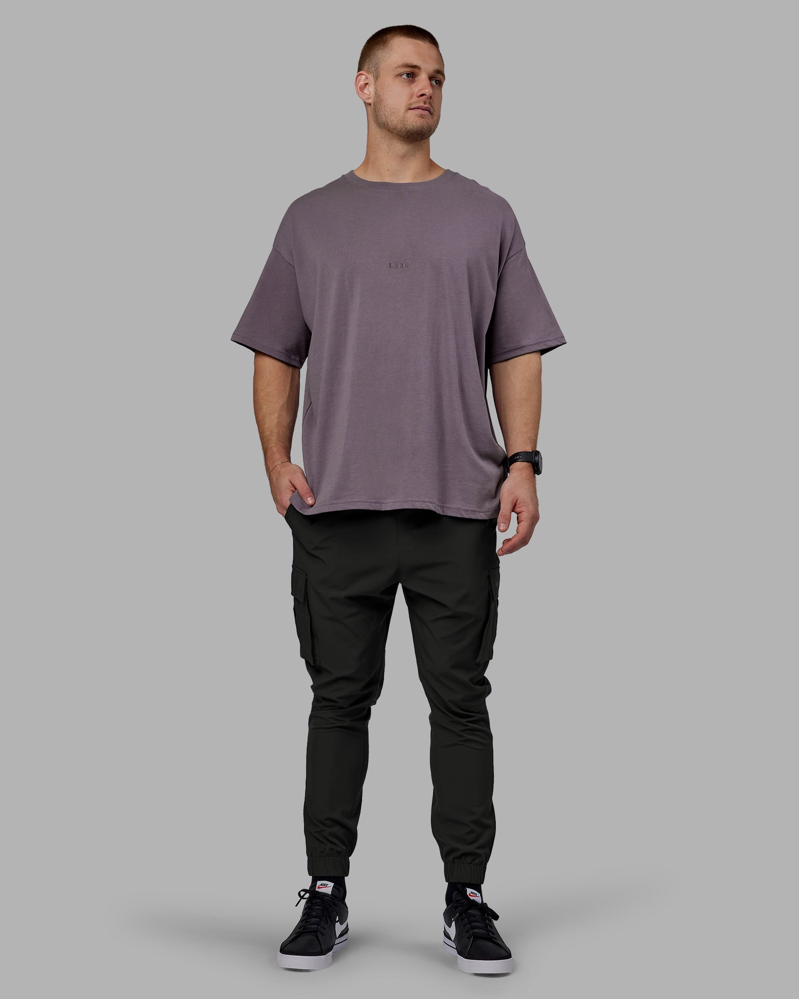 Man wearing Energy Stretch Performance Cargo Joggers - Pirate Black