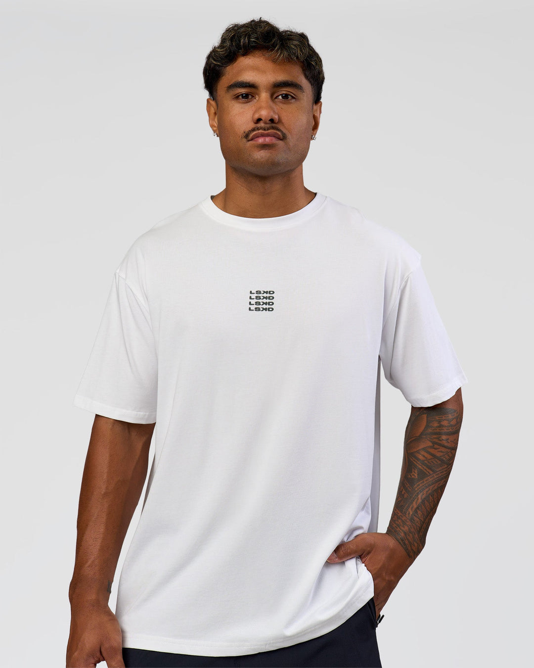 Man wearing Everyday Elevation FLXCotton Oversized Tee - White-Carbon Green | Model:Xav | Size:L