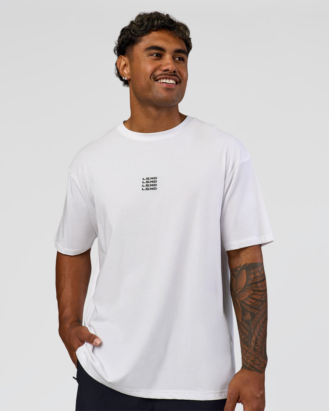 Man wearing Everyday Elevation FLXCotton Oversized Tee - White-Carbon Green | Model:Xav | Size:L