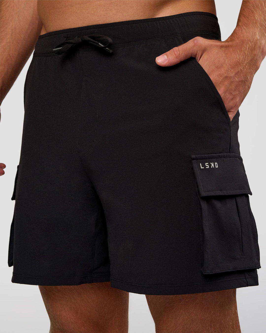 Man wearing Functional Cargo 6" Short - Black | Model:Marcus | Size:L