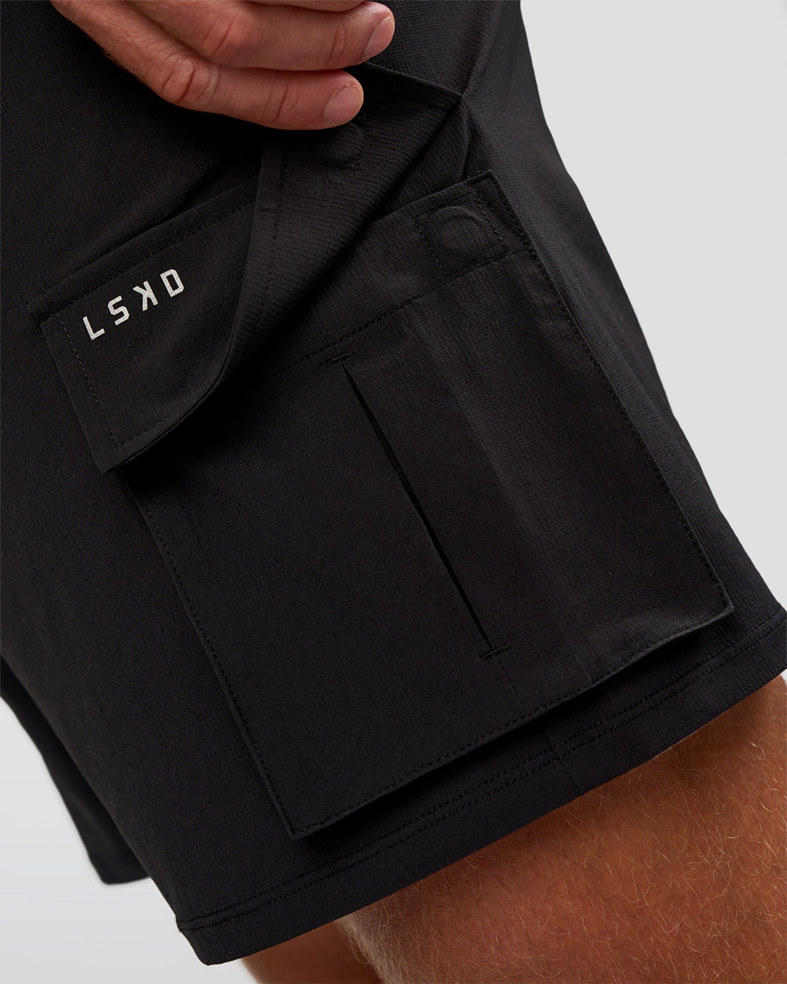 Man wearing Functional Cargo 6" Short - Black | Model:Marcus | Size:L