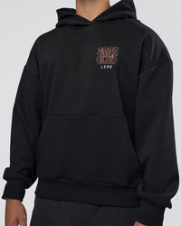 Man wearing GTC CVC Fleece Unisex Oversized Hoodie - Black-Cantaloupe | Model:Nikola | Size:L