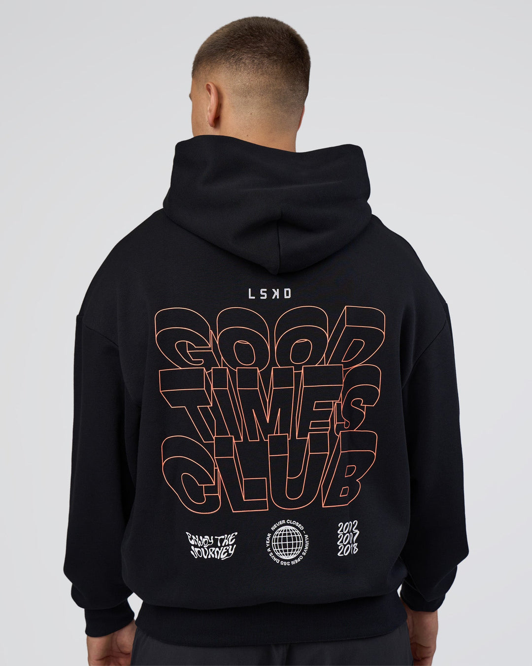 Man wearing GTC CVC Fleece Unisex Oversized Hoodie - Black-Cantaloupe | Model:Nikola | Size:L