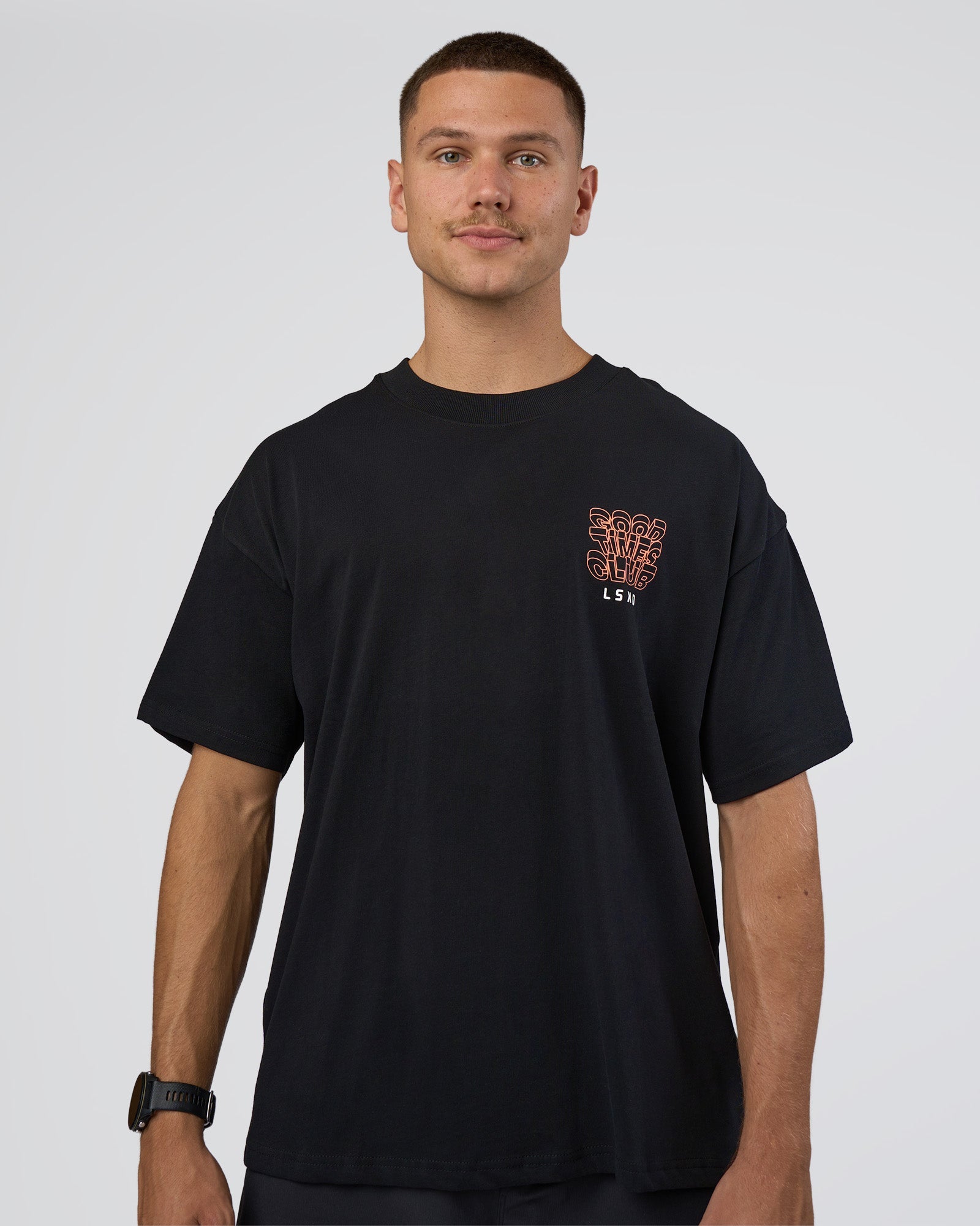 Man wearing GTC Heavyweight Oversized Tee - Black-Cantaloupe | Model:Nikola | Size:L