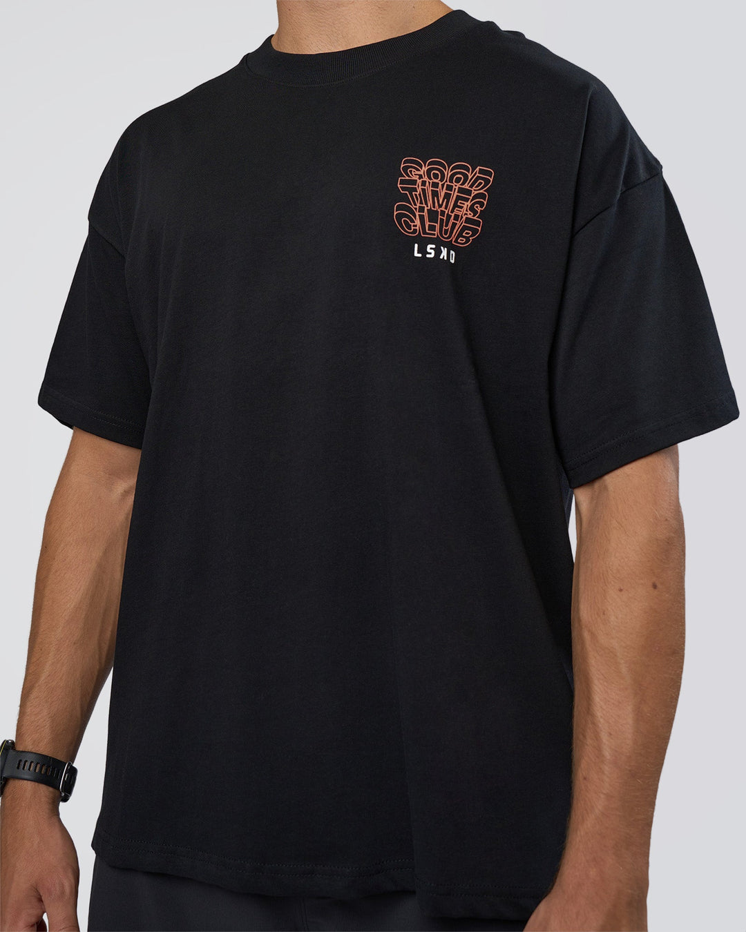 Man wearing GTC Heavyweight Oversized Tee - Black-Cantaloupe | Model:Nikola | Size:L