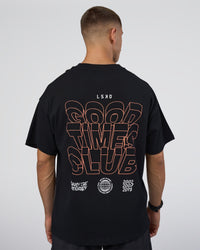 Man wearing GTC Heavyweight Oversized Tee - Black-Cantaloupe | Model:Nikola | Size:L