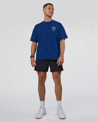 Man wearing GTC Heavyweight Oversized Tee - Washed Midnight Blue-Marsh | Model:Nikola | Size:L