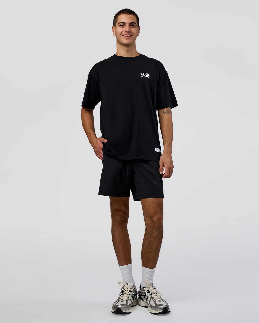 Man wearing Grid FLXCotton Oversized Tee - Black-White | Model:Zoran | Size:L