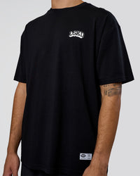 Man wearing Grid FLXCotton Oversized Tee - Black-White | Model:Zoran | Size:L