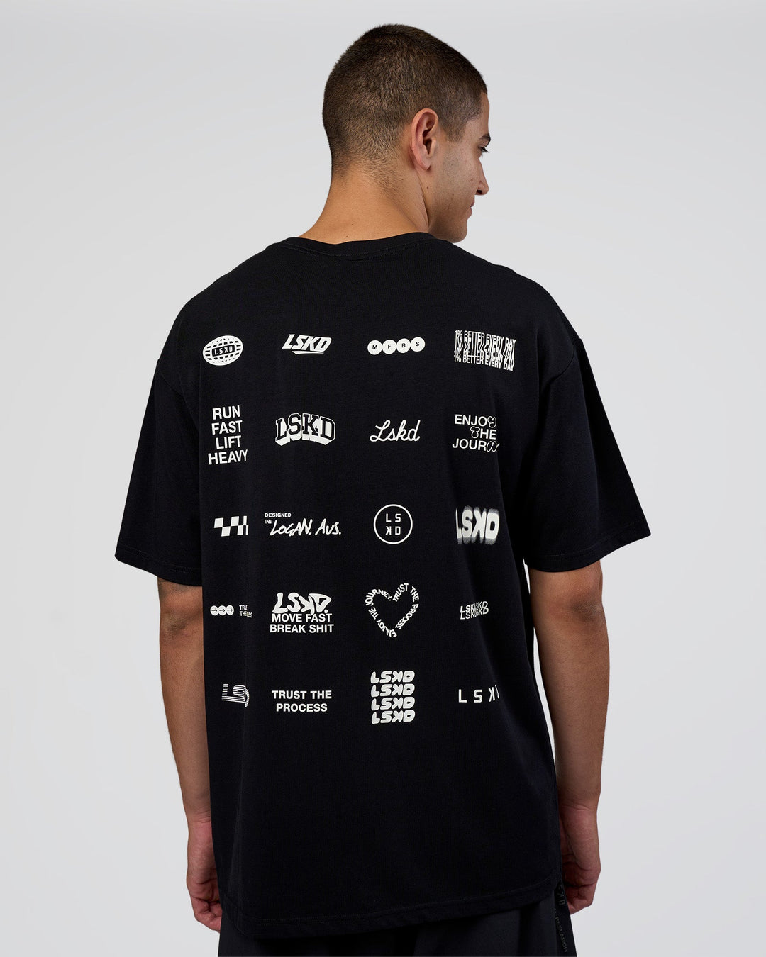 Man wearing Grid FLXCotton Oversized Tee - Black-White | Model:Zoran | Size:L