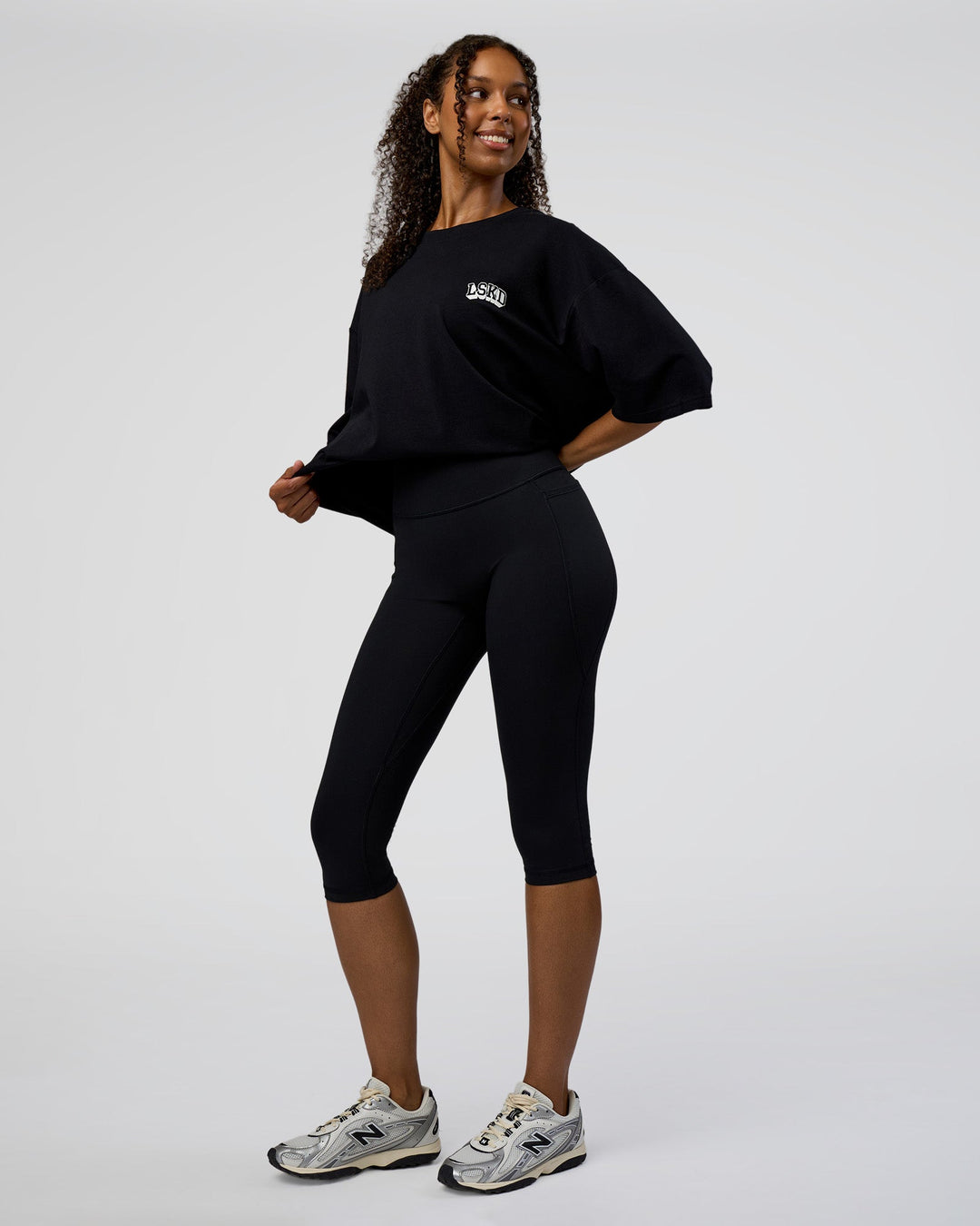 Woman wearing Grid FLXCotton Oversized Tee - Black-White | Model:Jordan | Size:L