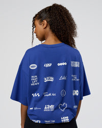 Woman wearing Grid FLXCotton Oversized Tee - Power Cobalt-White | Model:Jordan | Size:L