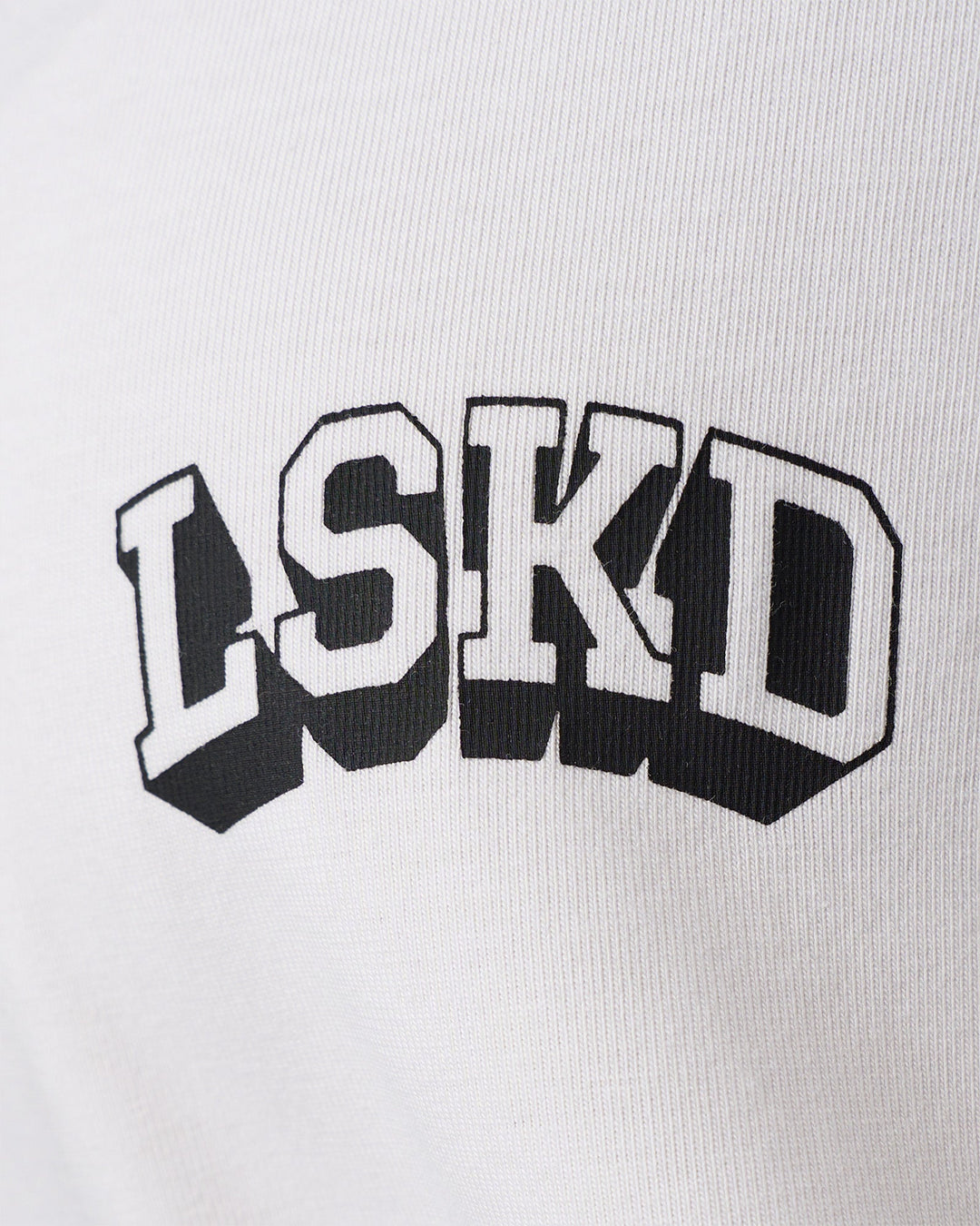 Woman wearing Grid FLXCotton Oversized Tee - White-Black | Model:Jordan | Size:L