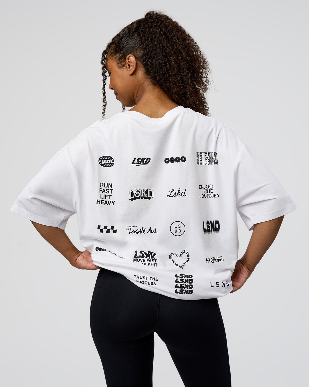 Woman wearing Grid FLXCotton Oversized Tee - White-Black | Model:Jordan | Size:L