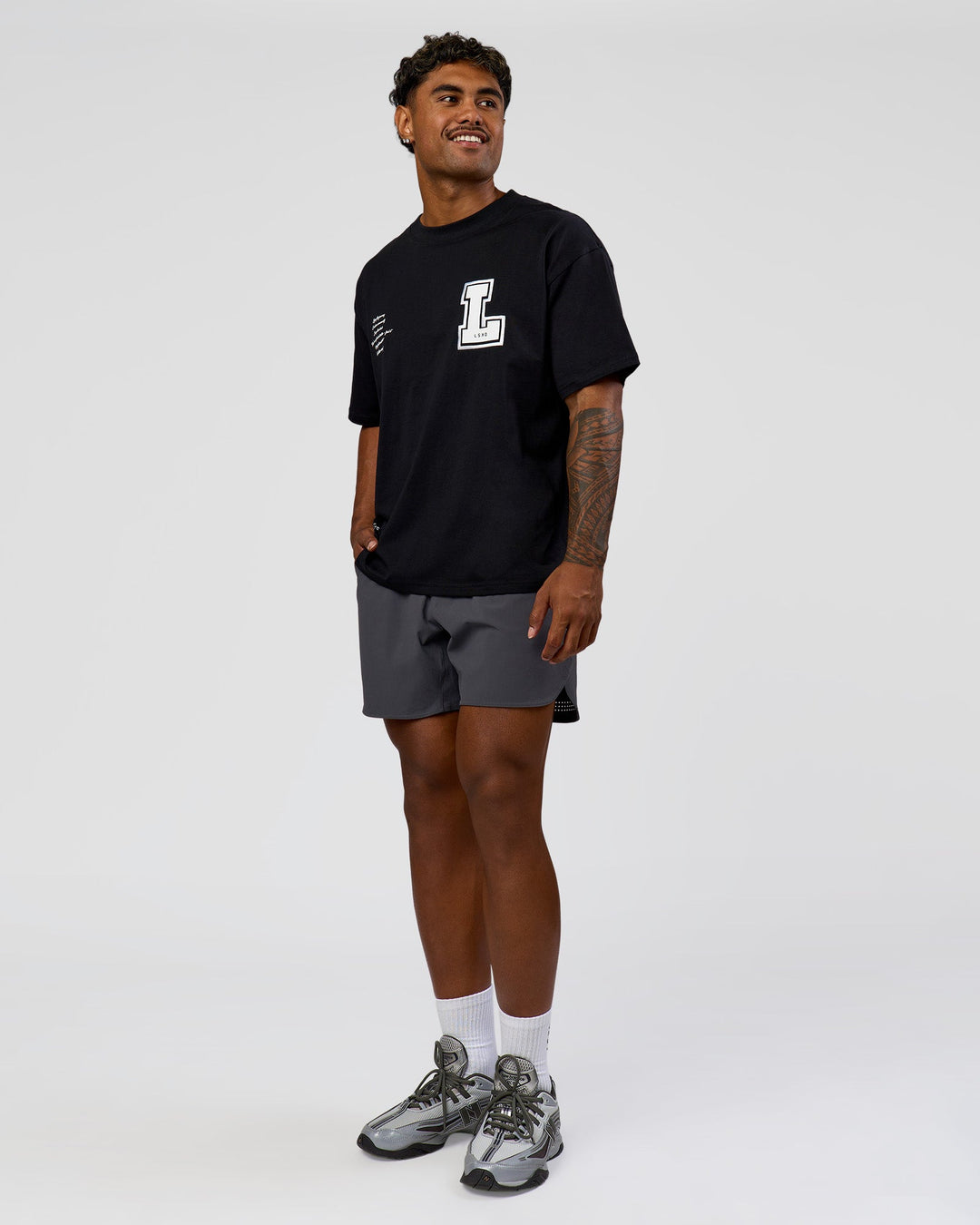 Man wearing Hype Heavyweight Unisex Oversized Tee - Black-White | Model:Xavier | Size:L