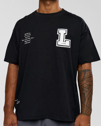 Man wearing Hype Heavyweight Unisex Oversized Tee - Black-White | Model:Xavier | Size:L